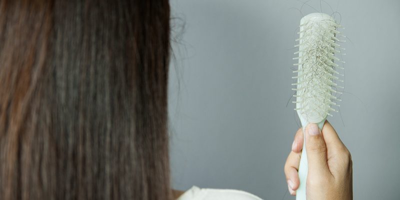 hair_44 Hairbrush with hairs on it